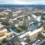Snow on the rooftops of the iconic AU yellow-brick buildings in the Aarhus University Park Nov 2022